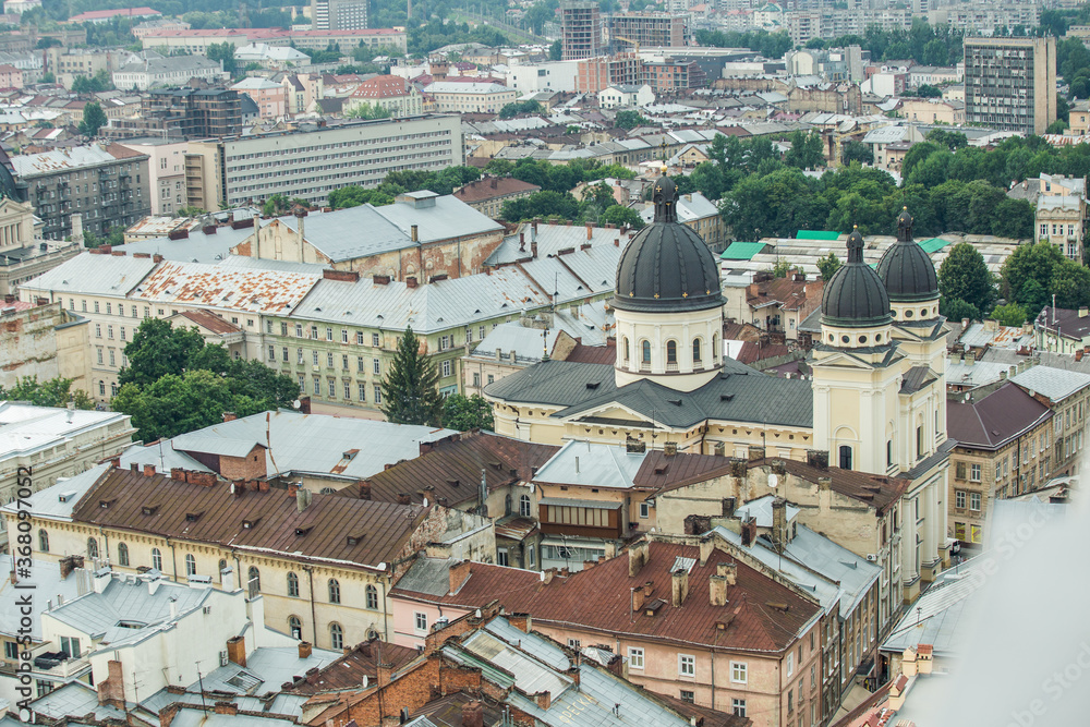 top view from town hall tower on old house rooftops in historical city center in Lviv