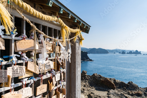 島の神社にある祀られたお札 photo