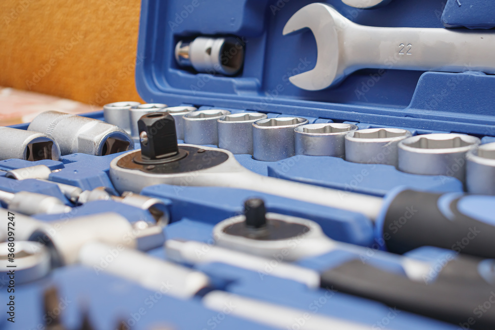 Fototapeta premium Close-up wrenches in a tool case. Chrome plated wrenches. Wrenches of different sizes and types.