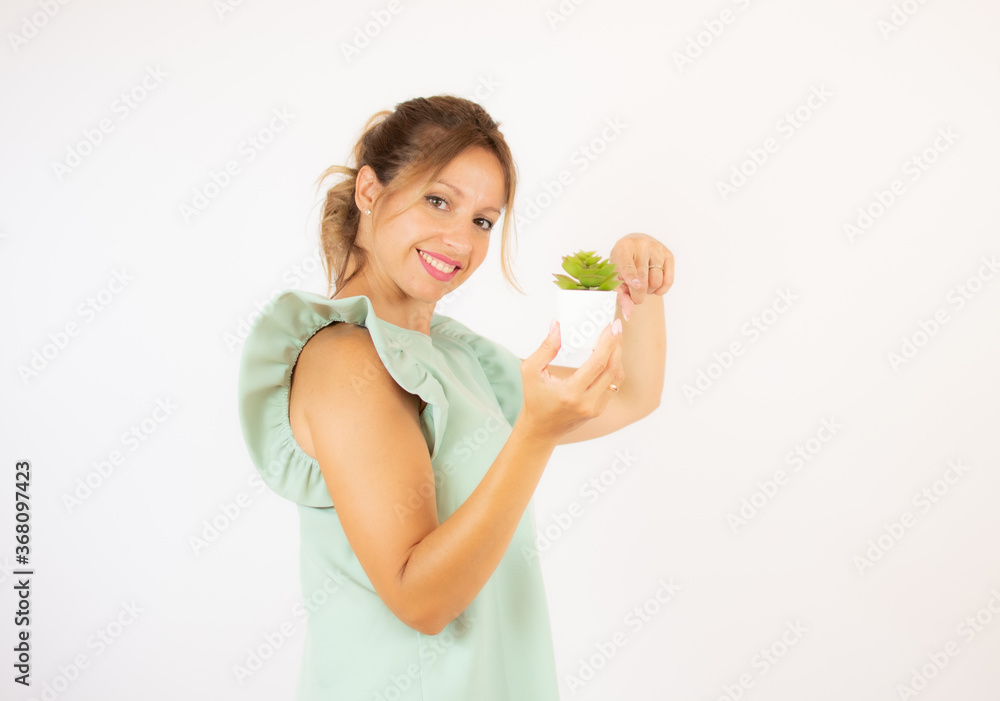 Beautiful woman in green dress on white background Beautiful woman in green dress on white background