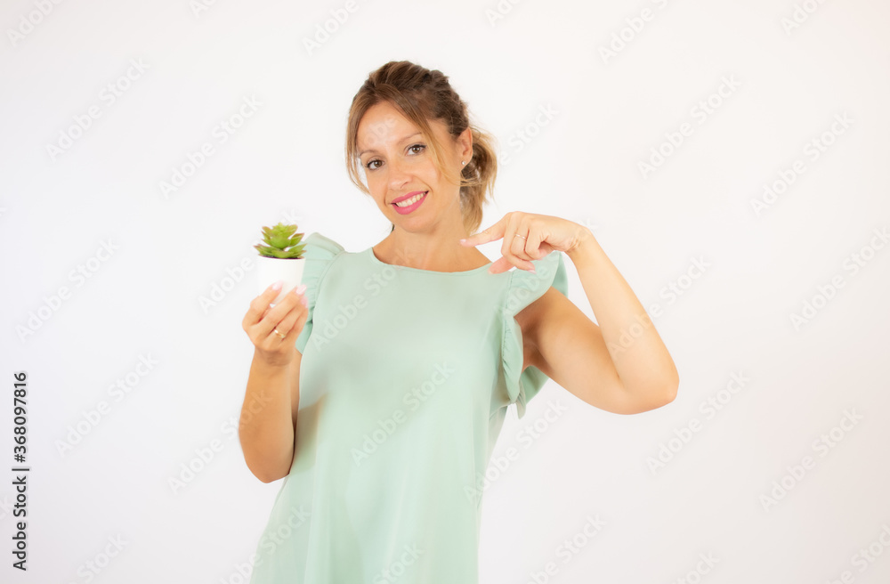 Beautiful woman in green dress on white background Beautiful woman in green dress on white background