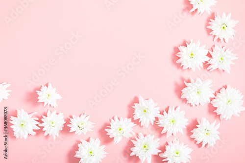 Fototapeta Naklejka Na Ścianę i Meble -  Beautiful flowers composition. White flowers on pastel pink background. Flat lay, top view, copy space