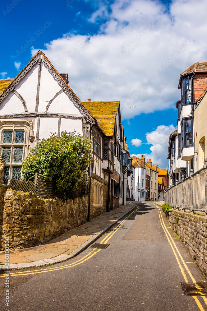 A traditional street of individual buildings in the old town of Hastings, Sussex in summer