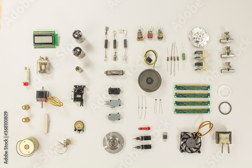 Fényképezés A flat lay of electronic and mechanical parts and components