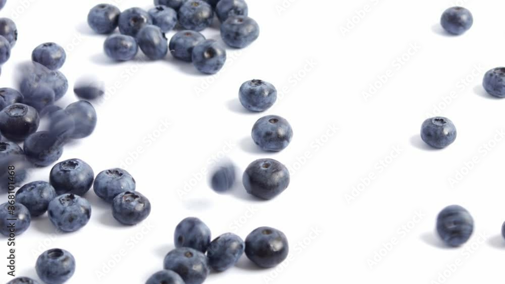 Filling the screen with a ripe blueberries. Close-up of falling berries. Blueberry background. Filling the screen with a ripe blueberries. Close-up of falling berries. Blueberry background.