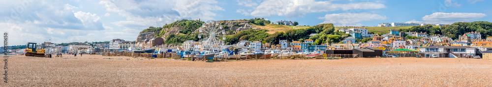 A panorama view across Hastings beach in summer