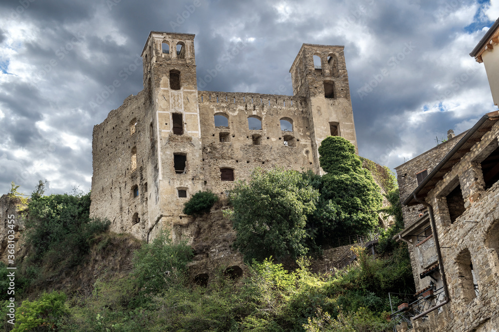 The ancient hilltop castle of Dolceacqua, Italy, in the Imperia Ligurian region, on an overcast day.