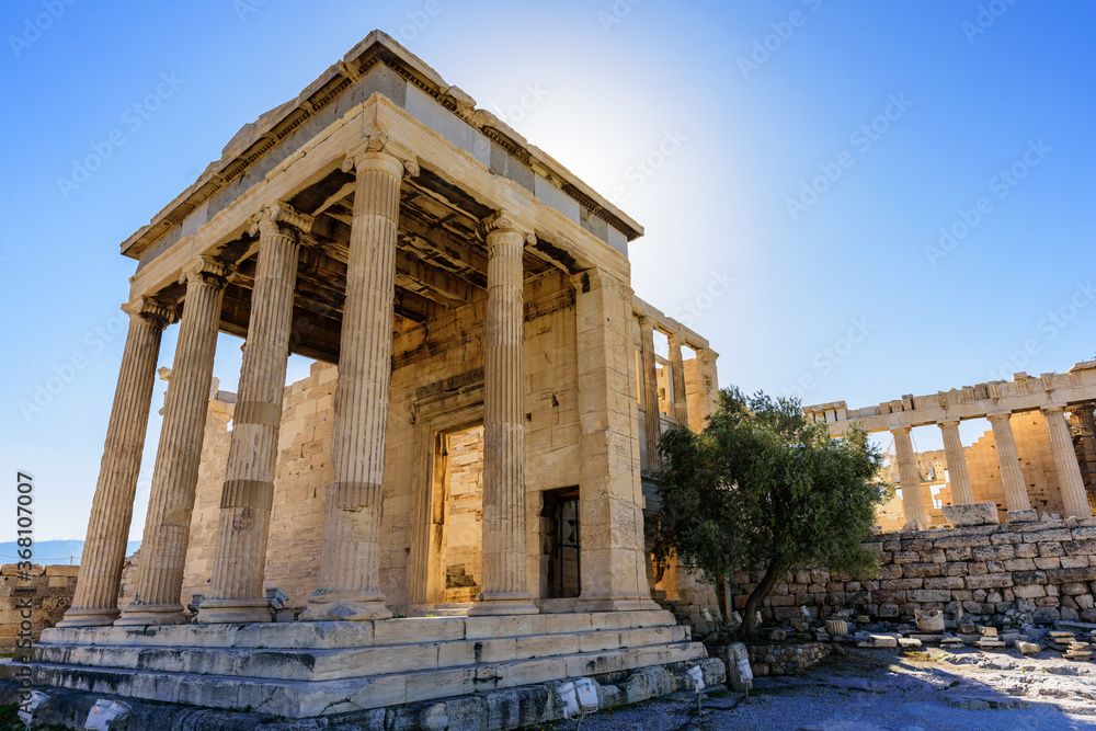 The Erechtheion is a temple in the Acropolis of Athens Honoring Athena and Poseidon, this famous, ancient Greek temple features a porch with 6 caryatids. 