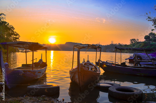 fishing boats at sunset