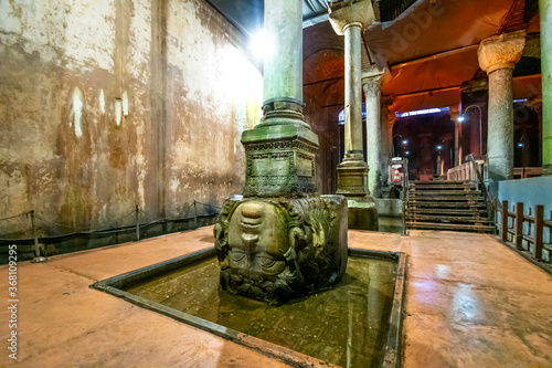 Photography The upside down stone Medusa head column in the ancient underground Basilica Cis