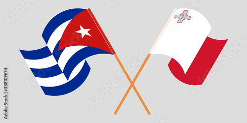 Crossed and waving flags of Cuba and Malta