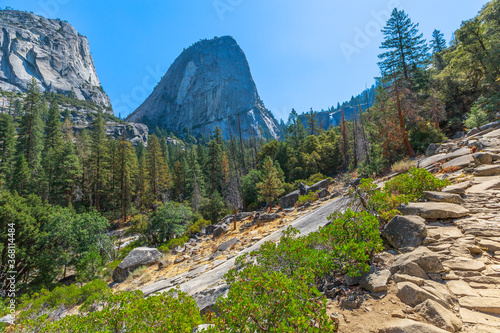 Panorama of Half Dome, Mt Broderick and Liberty Cap peaks on Mist trail in Yosemite National Park. Summer travel in California, United States of America. photo