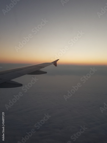 Dawn in airplane flying over South America