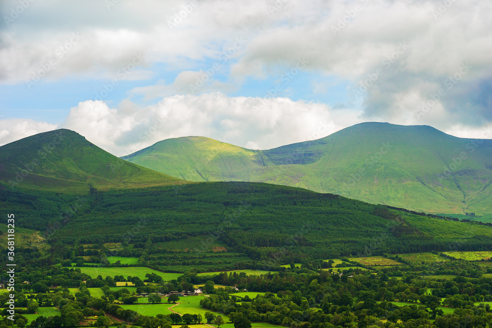 View of Galteemore mountain from Christ the King statue at the Glen of Aherlow, County Tipperary, Ireland. View of Galteemore mountain from Christ the King statue at the Glen of Aherlow, County Tipperary, Ireland.