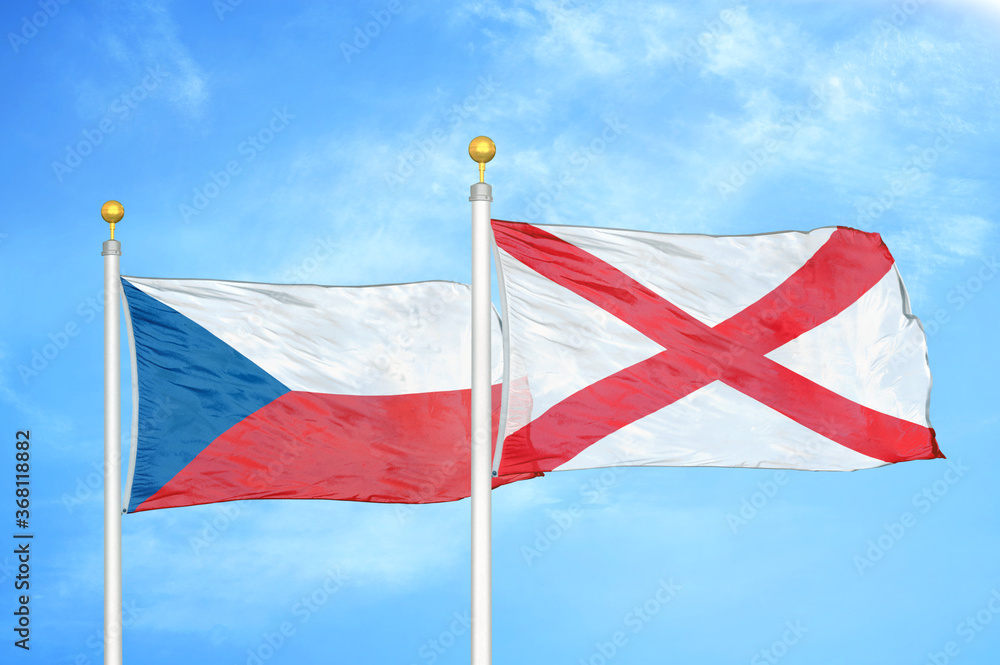 Czech and Northern Ireland two flags on flagpoles and blue cloudy sky