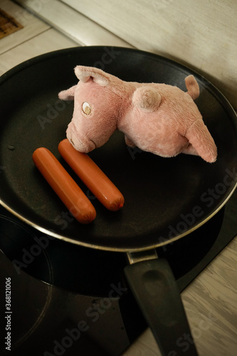 toy pig in a skillet in the kitchen