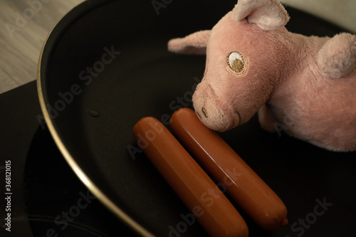 toy pig in a skillet in the kitchen
