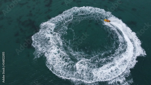 A fast motor boat making a circle on the water