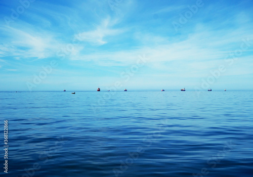 Boats in the harbor by a very calm sea  © bachir