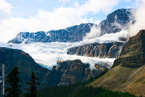 Crowfoot Glacier is located in Banff National Park, Alberta, Canada, near Lake Louise, and Icefields Parkway. The glacier has retreated, no longer looking like the glacier which early explorers named.
