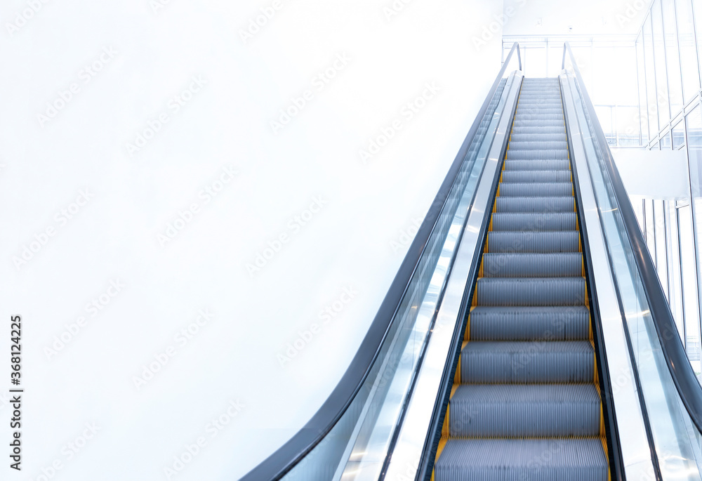 modern escalator view from below. Copy space modern escalator view from below. Copy space