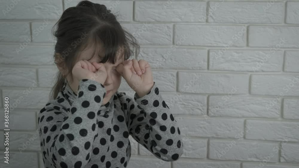 Crying child indoor. Crying little girl. Crying child indoor. Crying little girl.
