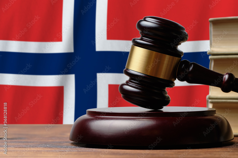 Justice and court concept in Kingdom of Norway. Judge hammer on a flag background