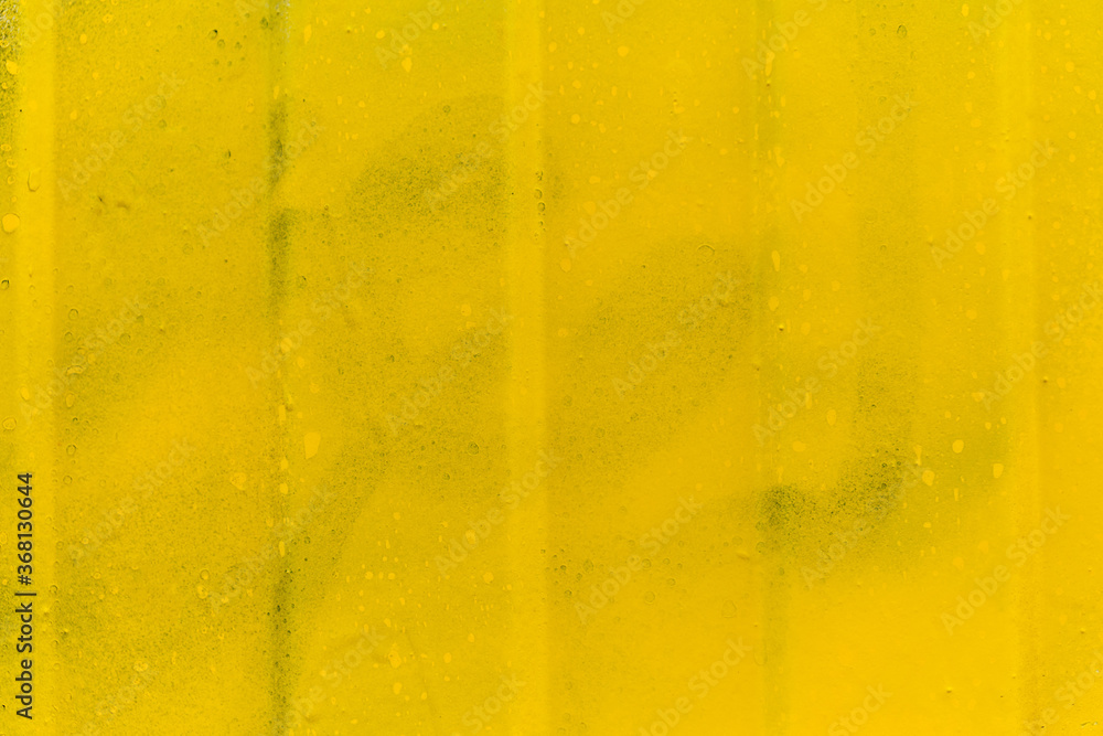 Metal siding and yellow wall. Close up. Metal siding and yellow wall. Close up.
