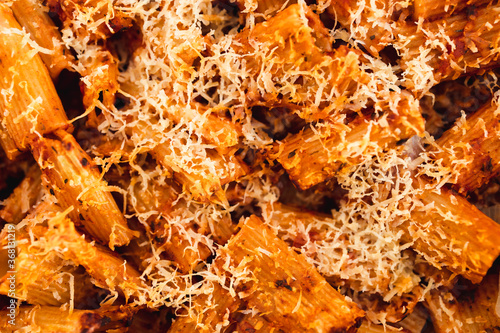 plant-based food, vegan rigatoni pasta bake with red pesto sauce and dairy free cheese