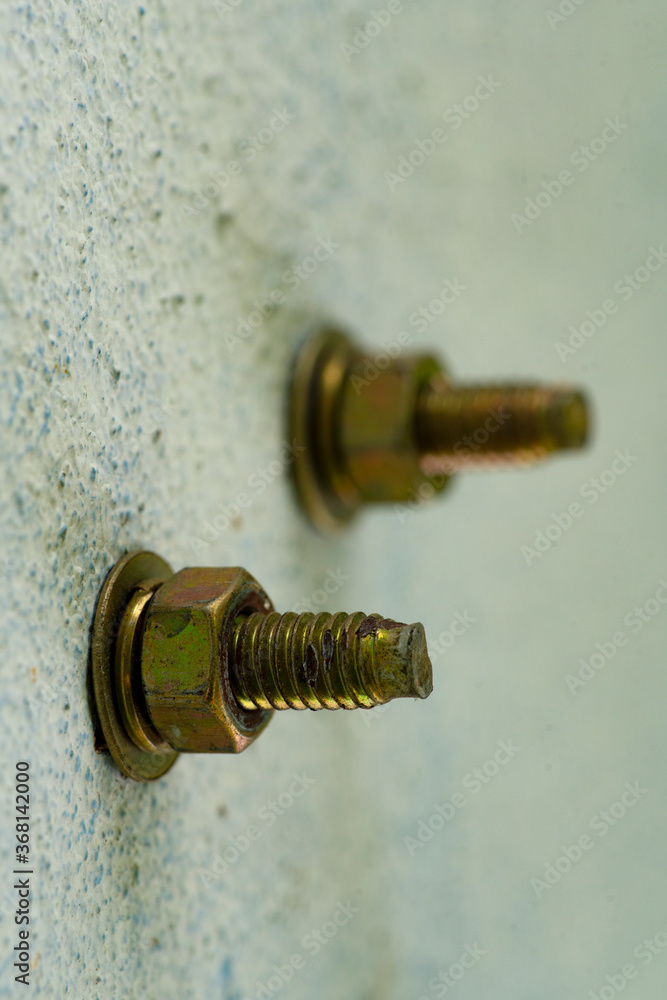 steel hex bolt and nut on the concrete wall,Construction work for connection. steel hex bolt and nut on the concrete wall,Construction work for connection.