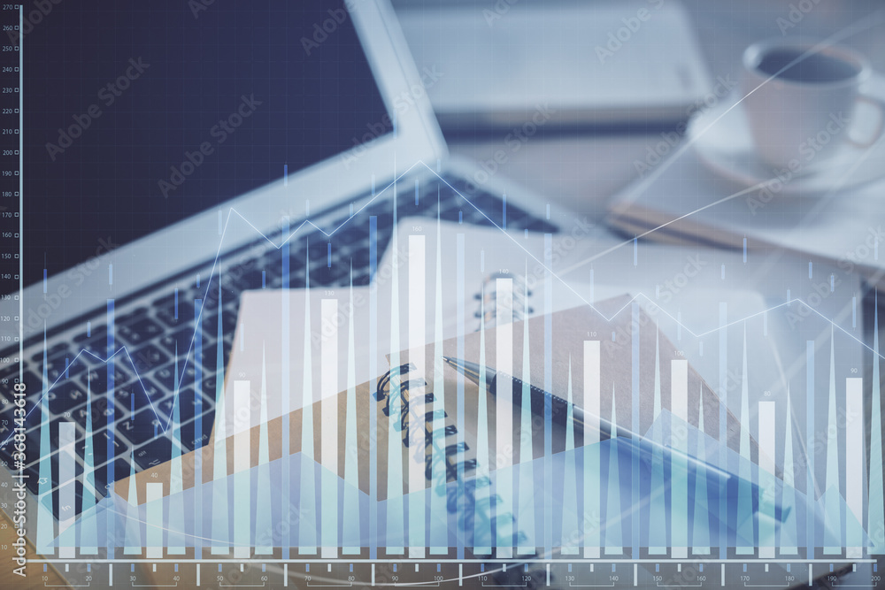 Double exposure of financial chart drawing and desktop with coffee and items on table background. Concept of forex market trading Double exposure of financial chart drawing and desktop with coffee and items on table background. Concept of forex market trading