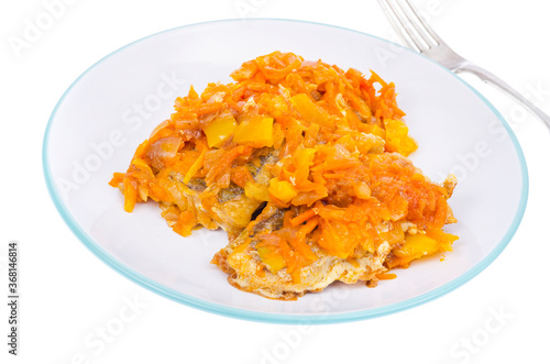 White fish fillet with stewed vegetables. Photo