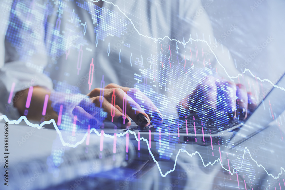 Double exposure of woman hands typing on computer and forex chart hologram drawing. Stock market invest concept. Double exposure of woman hands typing on computer and forex chart hologram drawing. Stock market invest concept.