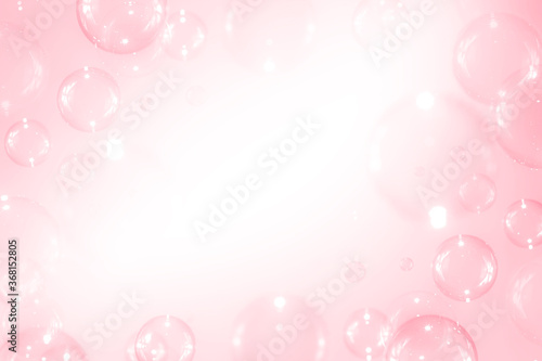 Beautiful blurry clear pink soap bubbles float background with copy space.