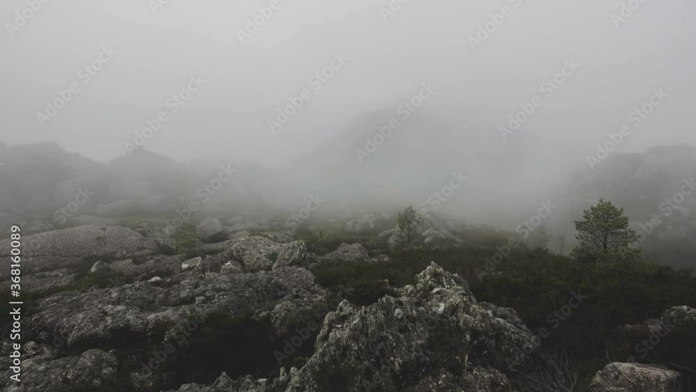 Time Lapse that starts off with mist and then clears up. High mountain in background Time Lapse that starts off with mist and then clears up. High mountain in background