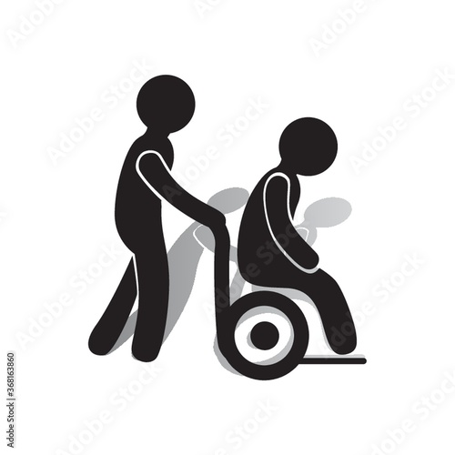 person in a wheelchair being helped
