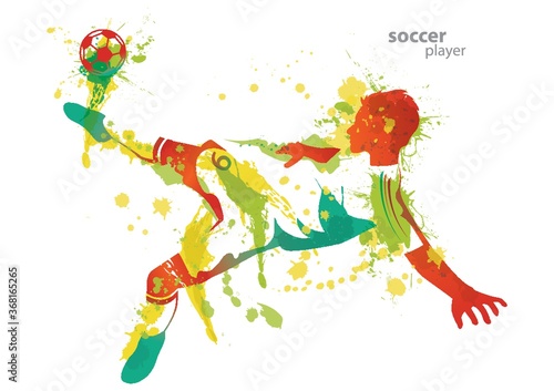 soccer player kicks a ball