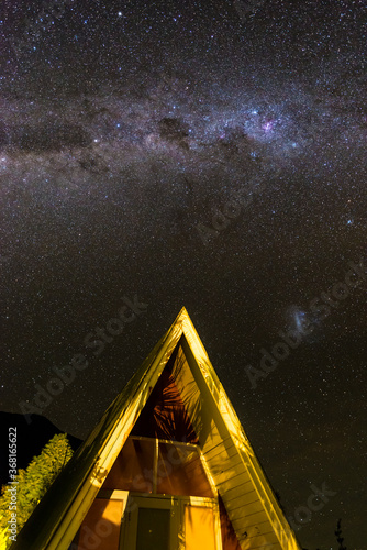 Holiday chalet in New Zealand under a sky full of stars and Milky Way