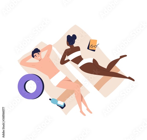 Relaxing people, sunbathing couple on beach. Woman and man lying, relaxing, c...