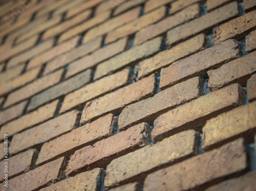 Old brick wall texture and background. Brickwork or stonework flooring interior for background. Selective focus.