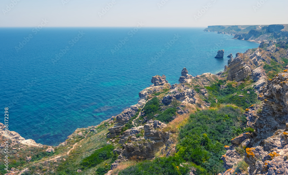 high rocky sea coast, summer marine vacation scene