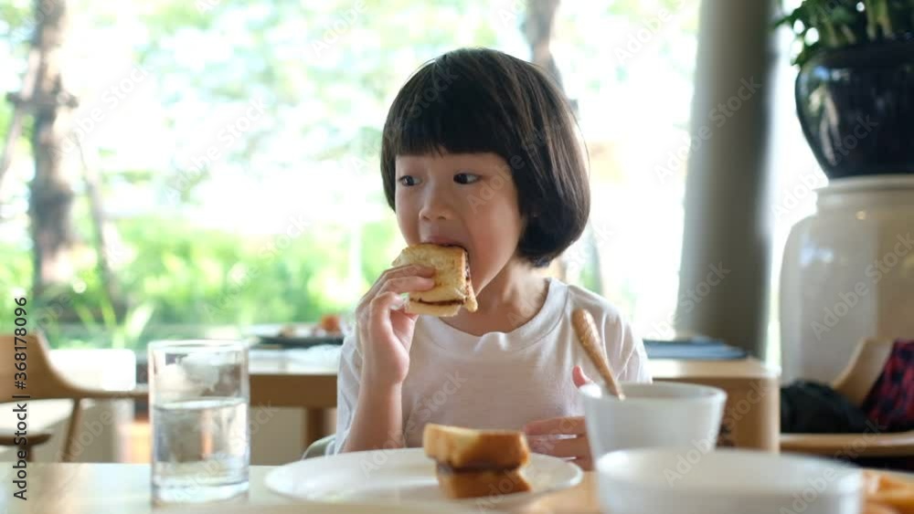 Kid eating food, happy time, breakfast

