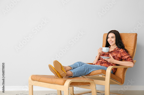 Young woman with tea relaxi...
