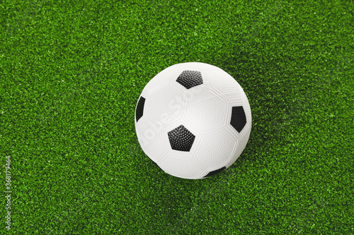 Soccer ball on green field