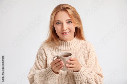 Beautiful woman with cup of...