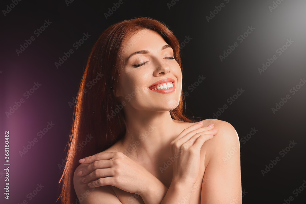 Beautiful redhead woman on dark background Beautiful redhead woman on dark background