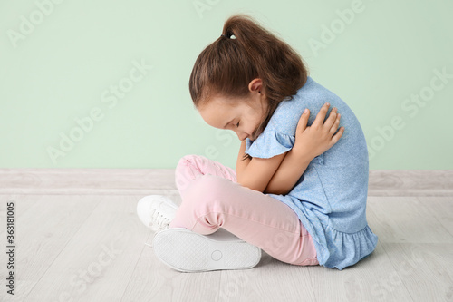 Sad little girl with autist...