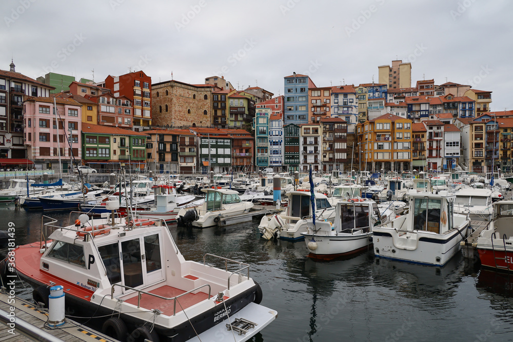 The magnificent port of Bermeo under a cloudy sky in the Basque Country