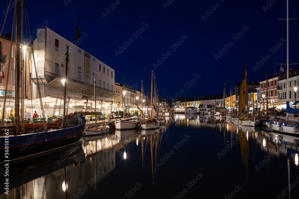  Night view of the port canal designed by Leonardo da Vinci and old town of Cesenatico on the Adriatic sea coast