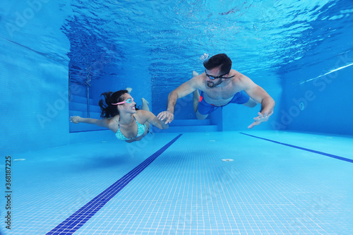 Cute couple having fun underwater